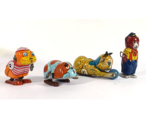 A Marx clockwork figure modelled as a cat playing with a ball, l. 13 cm and six further animal models (7)   CONDITION REPORT: