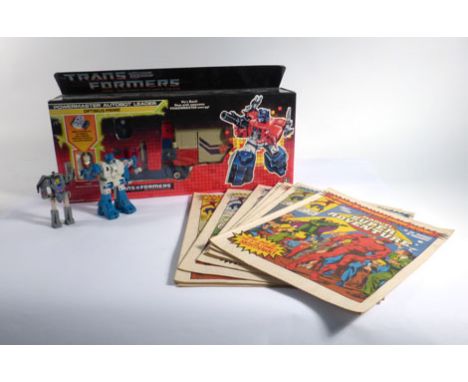 A group of Transformers collectable's, some boxed, together with a small group of 1980's Marvel comics (qty)