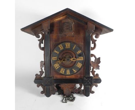 A Black Forest-type wall cuckoo clock in the form of a chalet, h. 29 cm   CONDITION REPORT:  Two weights and pendulum, some s