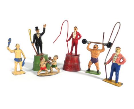 A mixed group of Charbens and other lead and cast metal circus figures including ringmasters, strong men, trapeze artists, ac