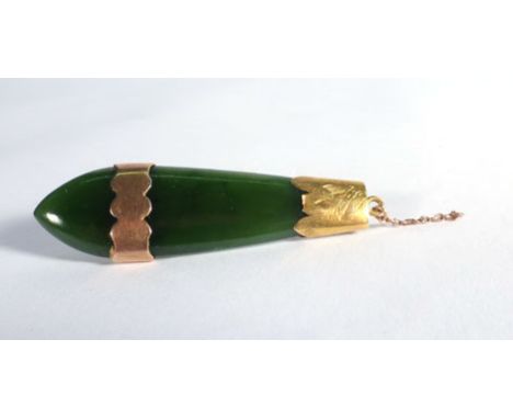 A yellow metal mounted green jade brooch of droplet form, w. 5 cm