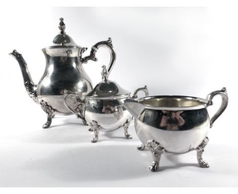 A silver plated three piece tea service of bulbous form   CONDITION REPORT:  Teapot handle with replacement insulators. Typic