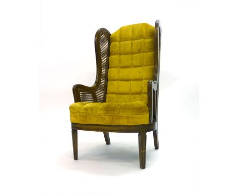 A late 19th century walnut, bergere and button upholstered wingback armchair