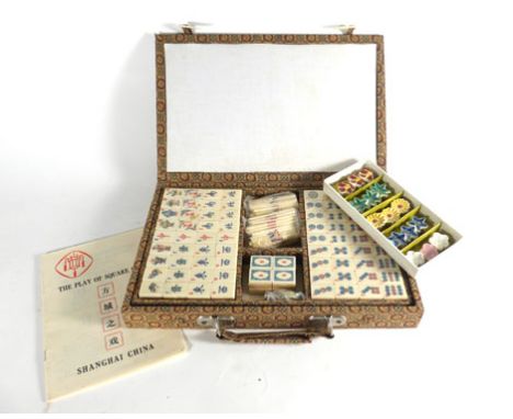 A modern mahjong set and a cased set of five chop stick rests (2) 