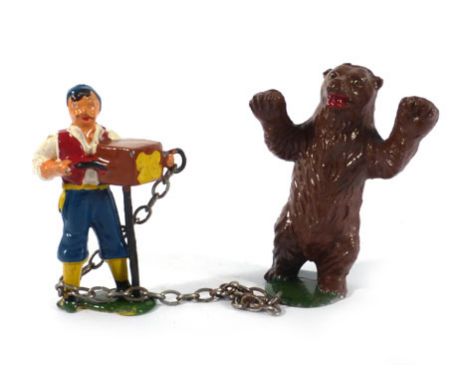 A Timpo lead gypsy organ grinder and dancing bear on a chain, partial box   CONDITION REPORT:  Typical losses and wear. Box p