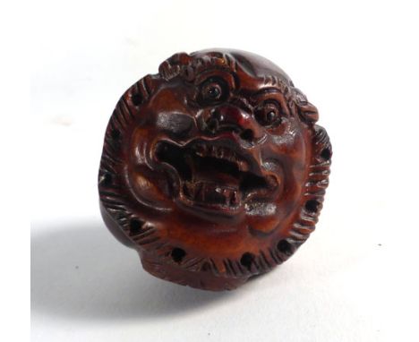 A modern carved wood netsuke in the form of a tiger's head, signed, h. 4 cm   CONDITION REPORT:  Minor wear