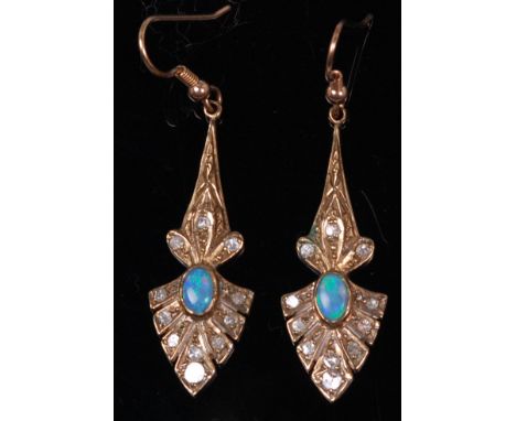 A pair of yellow metal, opal and diamond ear pendants, of leaf shape with centre cabochon opal, flanked by small rough cut di