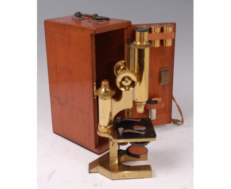 An R J Beck Ltd of London mahogany cased lacquered students monocular microscope, with rise-and-fall focus and fixed stage, n