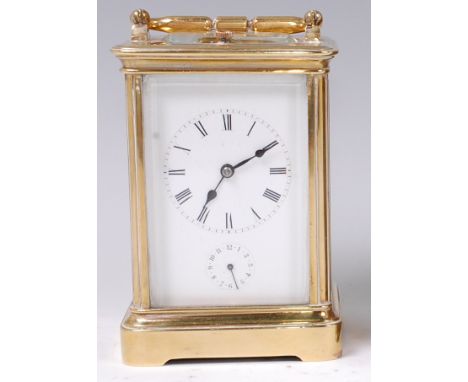 A late 19th century French lacquered brass cased carriage clock, having push button repeat and alarm, unsigned white enamel, 