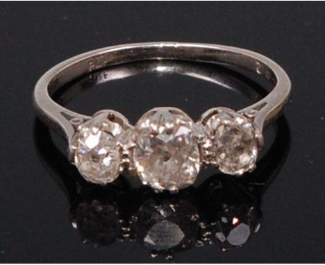 A platinum and diamond three stone ring, the centre claw set old brilliant weighing approx. 0.45ct, total diamond weight esti