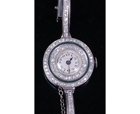 A Tiffany & Co white metal and diamond set cocktail watch, the signed circular dial with Arabic numerals, within a twin borde