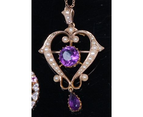 An Edwardian yellow metal, amethyst and seed pearl set openwork pendant, with further seed pearl set bale, 4.7cm, on finelink