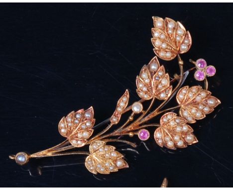 A circa 1900 18ct gold, seed pearl and pink sapphire set leaf and flower brooch, the stones in rub-over and milligrain settin