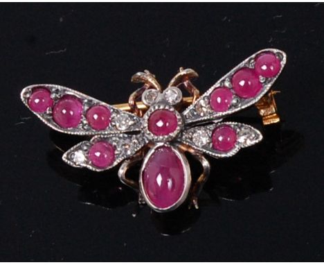 A yellow metal and white metal faced, ruby and diamond insect brooch, in the form of a fly, its wings and body set with small