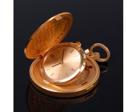 An Omega 18ct gold cased coin watch, the whole set into a United States $20 coin, dated 1904, the hinged watch within the coi