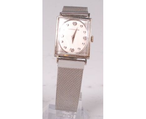 A gents Longines white metal cased wristwatch, having a signed dial with diamond point and steel markers, manual wind movemen