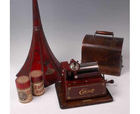 A Thomas Edison Gem phonograph, serial number 319148D, in stencilled oak case with lithograph printed octagonal metal trumpet