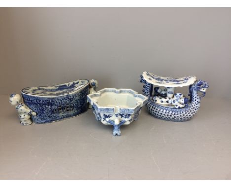 3 Chinese blue &amp; white ceramics, including a Chinese ceramic pillow flanked by  moulded boys at each side &amp; a Chinese