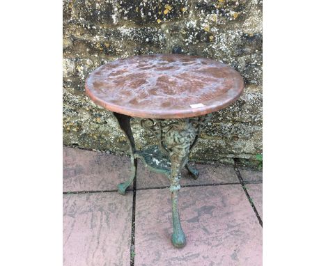 Victorian cast iron base tripod table with later copper top 68 cm h 55 dia