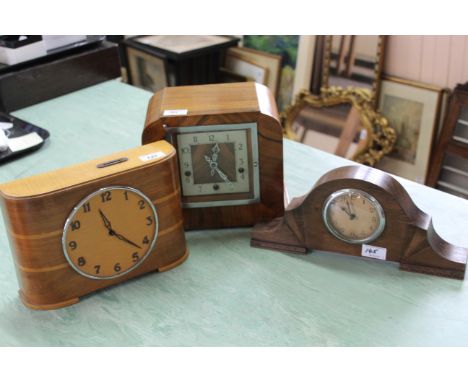 A walnut cased striking chiming mantel clock, an oak cased mantel clock plus an unusual pale veneered mantel clock by 'The Ti