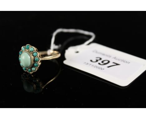 A large 9ct gold turquoise cluster ring of flower form setting, size P, approx 4.5g