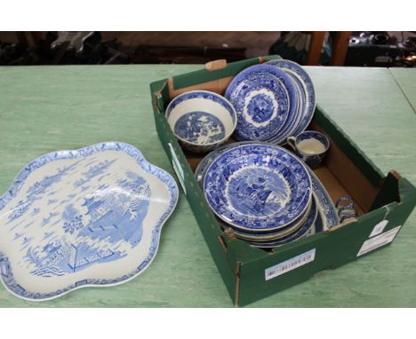 A box of vintage blue and white tableware including Wedgwood and Willow pattern plates plus a large Royal Worcester charger
