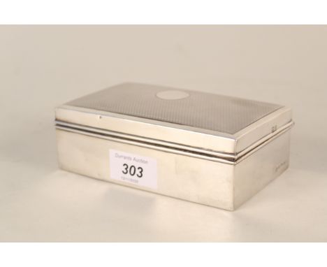 A silver cigarette box with engine turned decoration (some dents), Birmingham 1928
