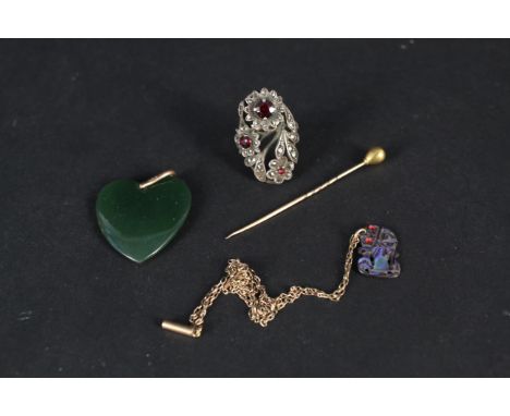 A 9ct gold and silver ring set with marcasite and paste stones, a 9ct gold mounted heart shaped jade pendant, a yellow metal 