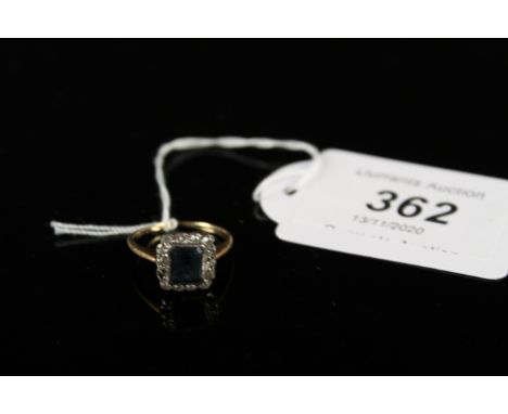 A yellow metal diamond and blue stone set ring (one diamond missing), size K 1/2, approx 2.5g