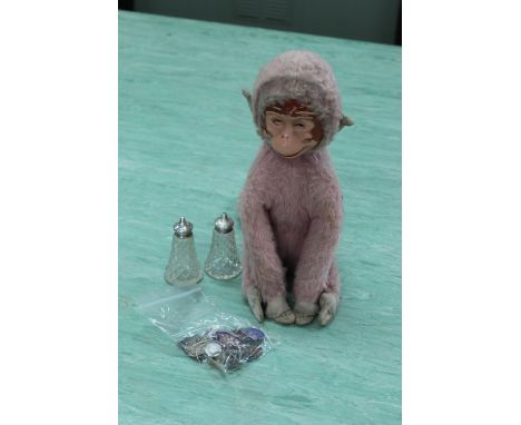 A 1960's pink plush plastic face monkey, a pair of cut glass silver topped cruets plus a selection of enamel pin badges and c