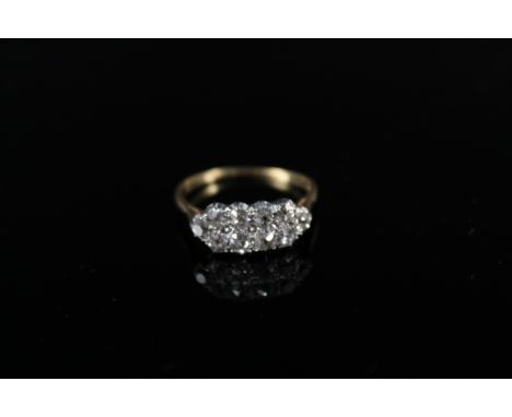 An 18ct gold diamond ring with two rows of old cut diamonds set in white metal (possibly platinum), size R