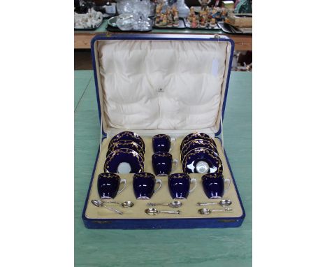 A cased Royal Worcester for Mappin &amp; Webb set of six coffee cups and saucers with a set of six hallmarked silver coffee s