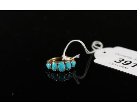 An unmarked yellow metal ring set with five turquoise stones, size K 1/2, approx 2.5g
