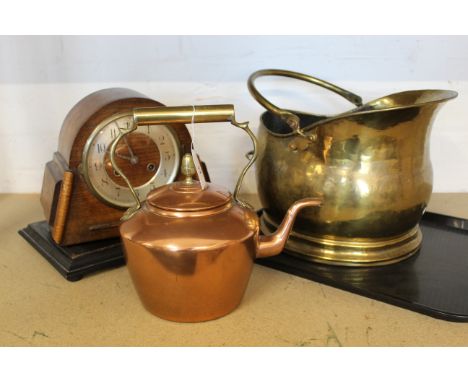 A brass coal helmet, copper kettle and an oak cased mantel clock
