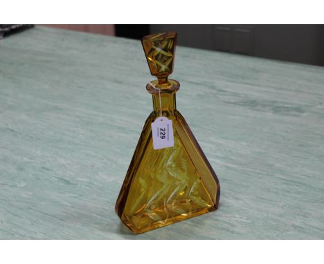 A large Art Deco style amber cased glass decanter, 12" tall (small chip to stopper)