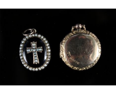 A 9ct gold circular photo locket with engraved edge details together with a yellow metal mourning pendant, black enamel and s