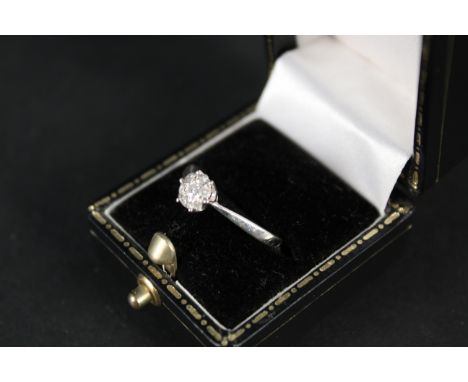 A 9ct white gold diamond cluster ring, size O