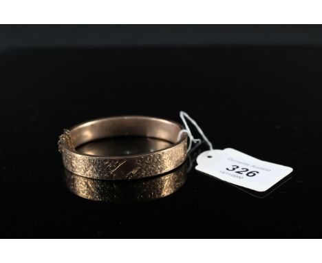A 9ct gold foliate engraved bangle (heavily dented), approx 14g