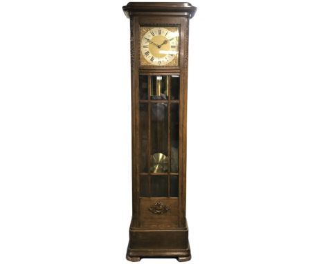 Early 20th century oak longcase clock, the case with astragal bevel glazed door and scrolling foliage carved decoration, trip