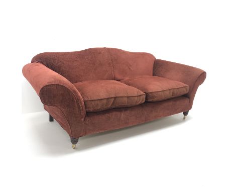 Multi-York three seat sofa, upholstered in a maroon fabric, shaped back, scrolling arms, turned supports on castors, W210cm C