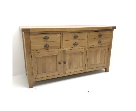Light oak sideboard, four drawers above three cupboards, stile supports, W160cm, H91cm, D57cm Condition Report Click here for