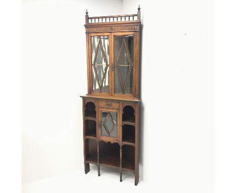 Edwardian mahogany corner cabinet, two finials and gallery cresting rail, three astragal glazed doors enclosing shelf, single