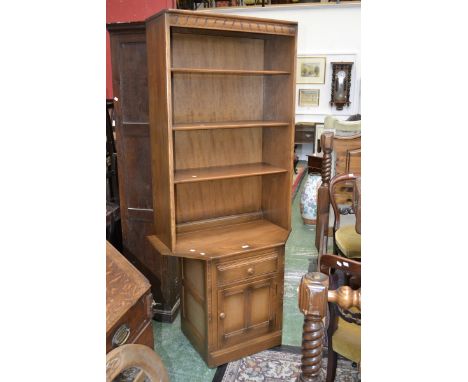 An Ercol golden dawn corner insert unit,three shelves to top,single drawer over panel door cupboard.