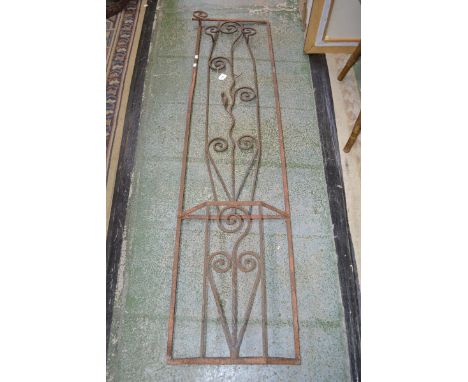 An unusual wrought iron coat stand, decorated in sworls and leafy stems, stick stand to base.