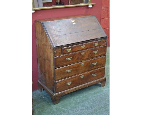 An early 18th century bureau, the fall front with fitted interior and well, above four long graduated drawers, bracket feet, 