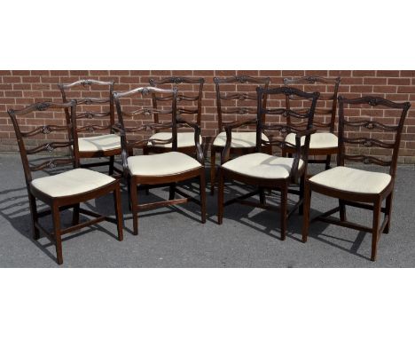 A set of eight George III design mahogany dining chairs, by James Shoolbred & Co, London, comprising six side chairs and a pa