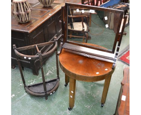 A 1940's oak dressing mirror, rectangular plate; an oak bowfront stick stand; a circular occasional table. (3)