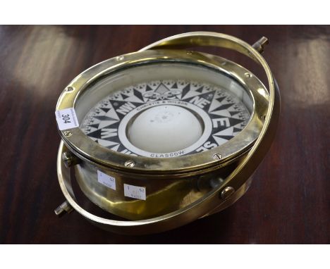 A Christie and Wilson, Glasgow, commercial gimballed ship's compass, 8" dial, brass body.
