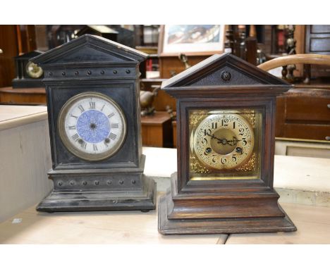 A late 19th century architectural mantel clock, twin winding holes, Arabic numerals, bevelled glass, 33cm high; an ebonised m
