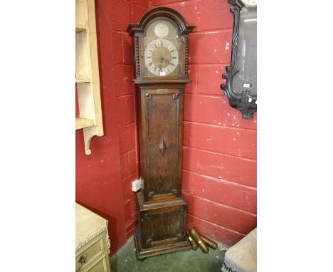 An oak longcase clock by Page, Keen & Page, Plymouth, arched top, brass spandrels, silvered chapter ring, Roman numerals.